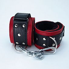 Красно-чёрные кожаные наручники с меховым подкладом 
Кожаные наручники красного цвета.