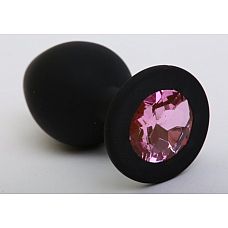 Чёрная силиконовая пробка с розовым стразом - 9,5 см. 
Силиконовая анальная пробка с ограничительным основанием для безопасного использования.