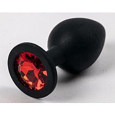 Чёрная анальная втулка с красным кристаллом - 7,3 см. 
Гладенькая силиконовая пробка с кристаллом в ограничительном основании. 