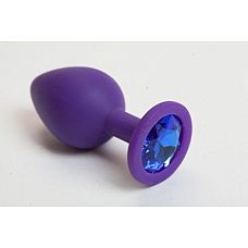 Фиолетовая силиконовая пробка с синим кристаллом - 7,3 см. 
Гладенькая силиконовая пробка с кристаллом в ограничительном основании.
